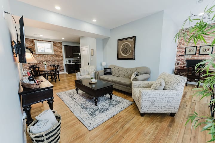 Exposed brick living area in the Downtown Gem apartment